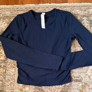 Lululemon all it takes, ribbed, back twist, long sleeve. Never worn